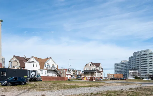 a view of multiple houses with a city
