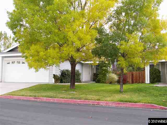 7683 Barnsdale Road Reno, NV 89511 - Photo 1 of 6 a house with tree in front of it