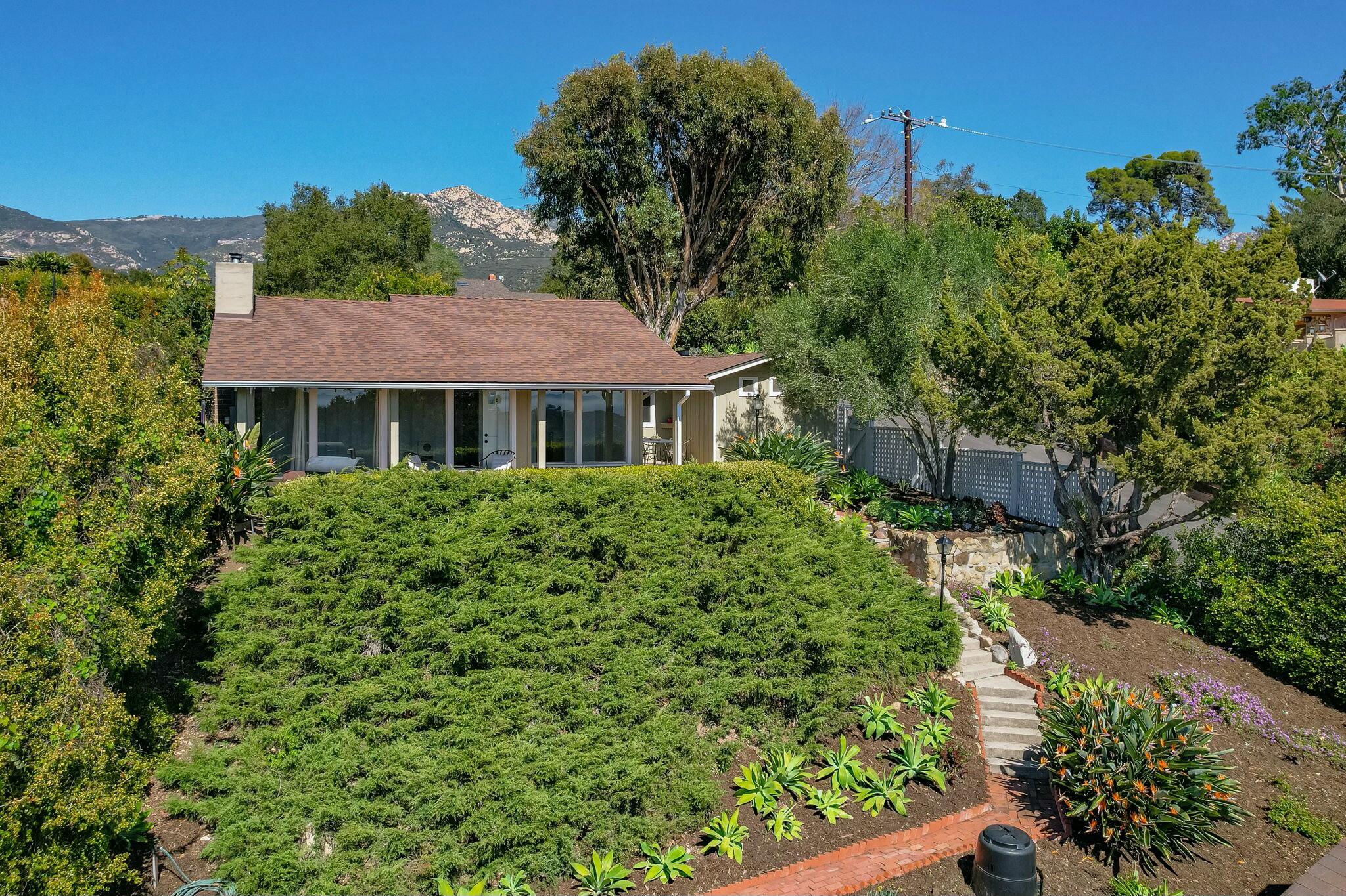 2986 Kenmore Place Santa Barbara, CA 93105 - Photo 2 of 49 a aerial view of a house with a yard and potted plants