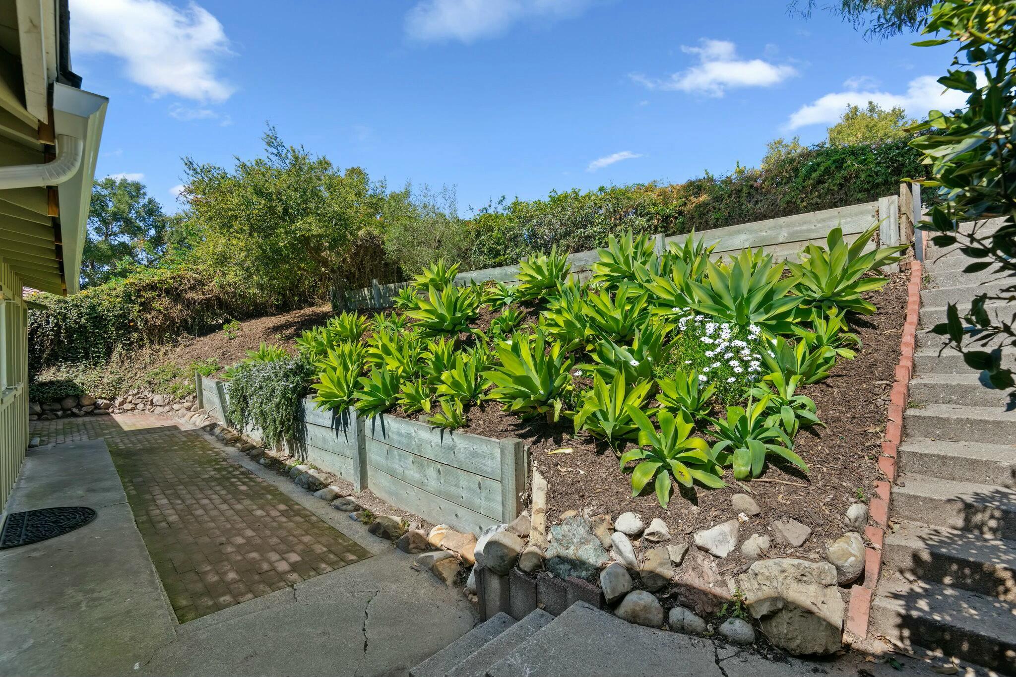2986 Kenmore Place Santa Barbara, CA 93105 - Photo 28 of 49 a view of a chair and table in the garden