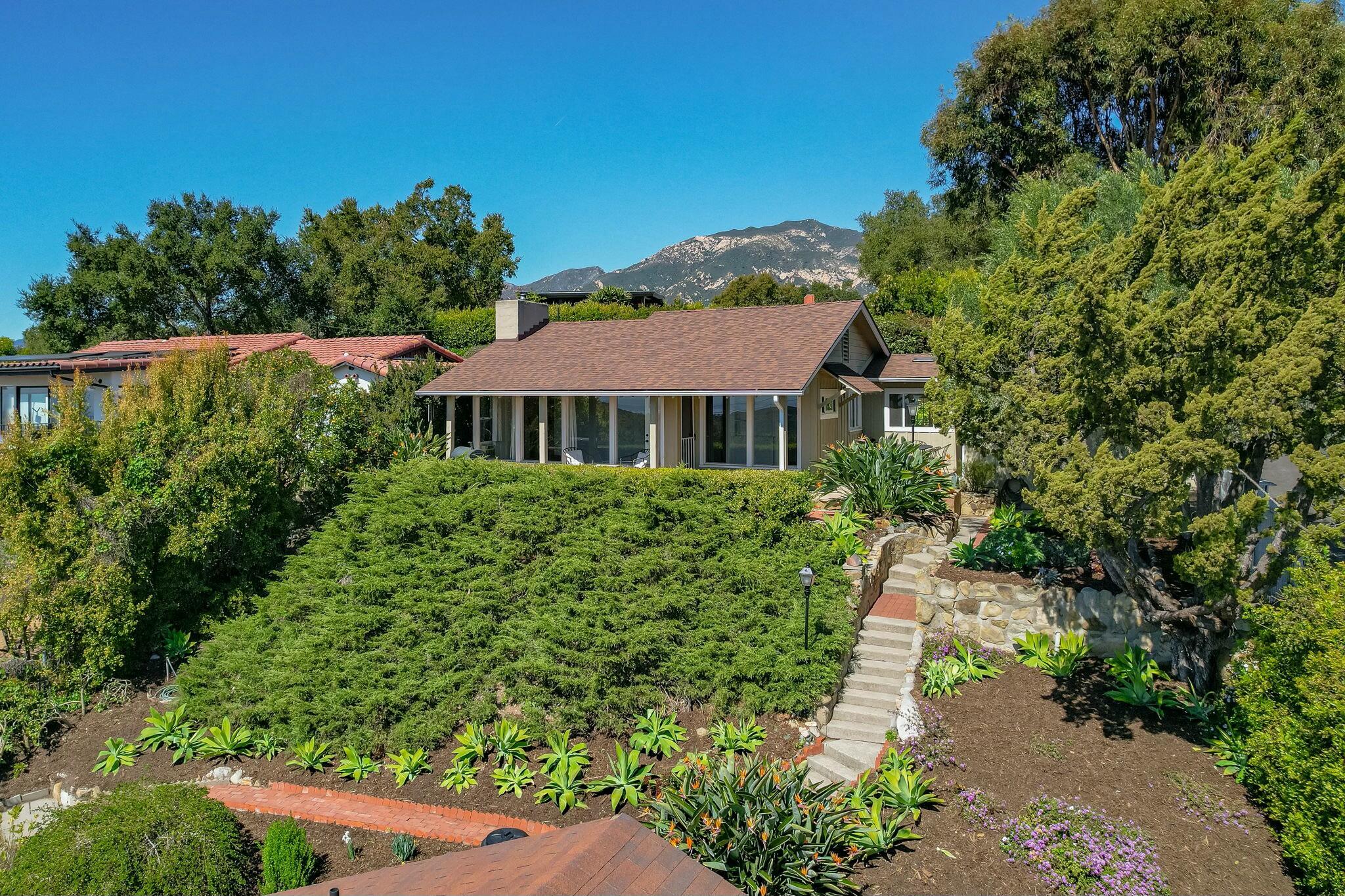 2986 Kenmore Place Santa Barbara, CA 93105 - Photo 3 of 49 a view of a garden with a house