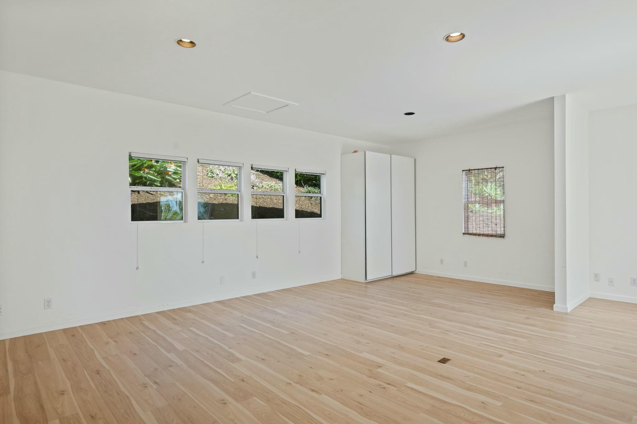 2986 Kenmore Place Santa Barbara, CA 93105 - Photo 38 of 49 a view of an empty room with wooden floor and a window