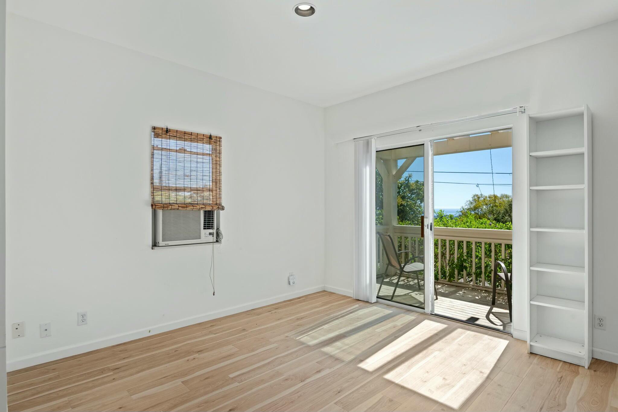 2986 Kenmore Place Santa Barbara, CA 93105 - Photo 41 of 49 a view of an empty room with wooden floor and a window
