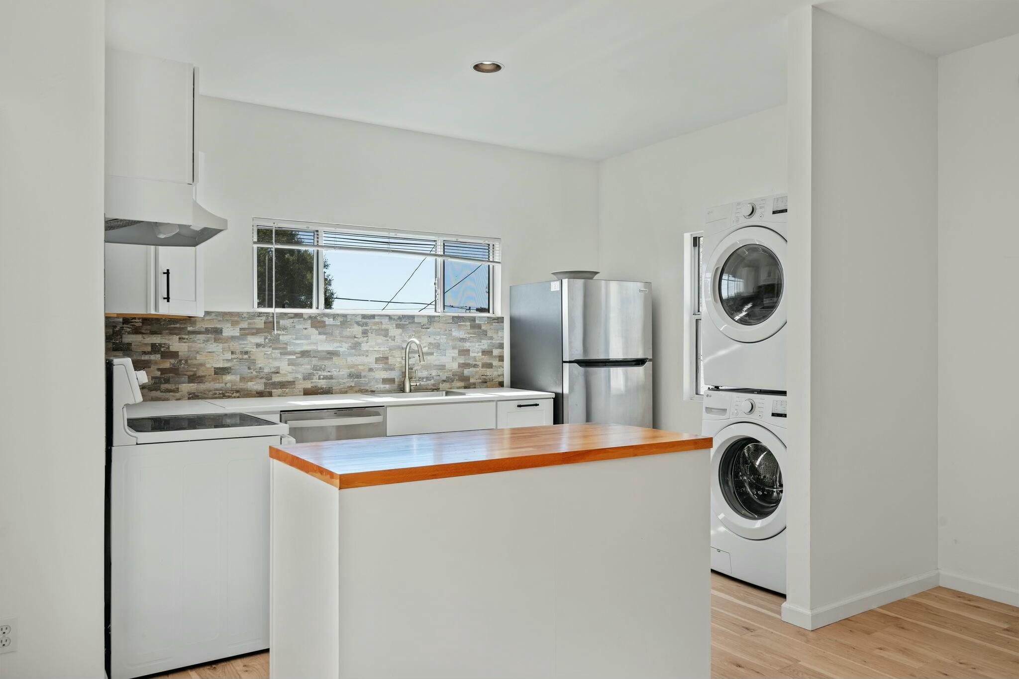 2986 Kenmore Place Santa Barbara, CA 93105 - Photo 43 of 49 a kitchen with stainless steel appliances granite countertop a sink and a stove