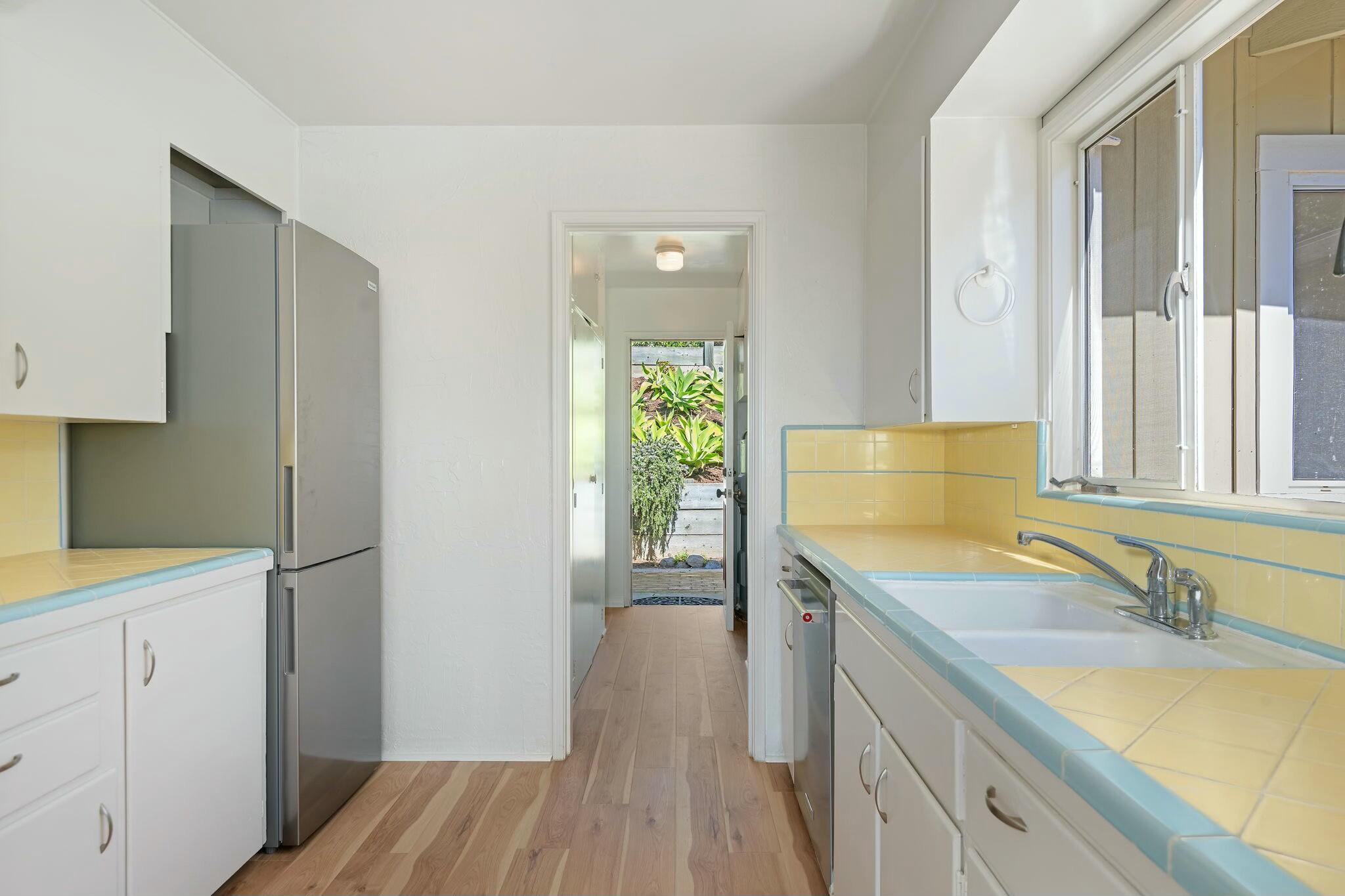 2986 Kenmore Place Santa Barbara, CA 93105 - Photo 9 of 49 a kitchen with a sink stove and refrigerator