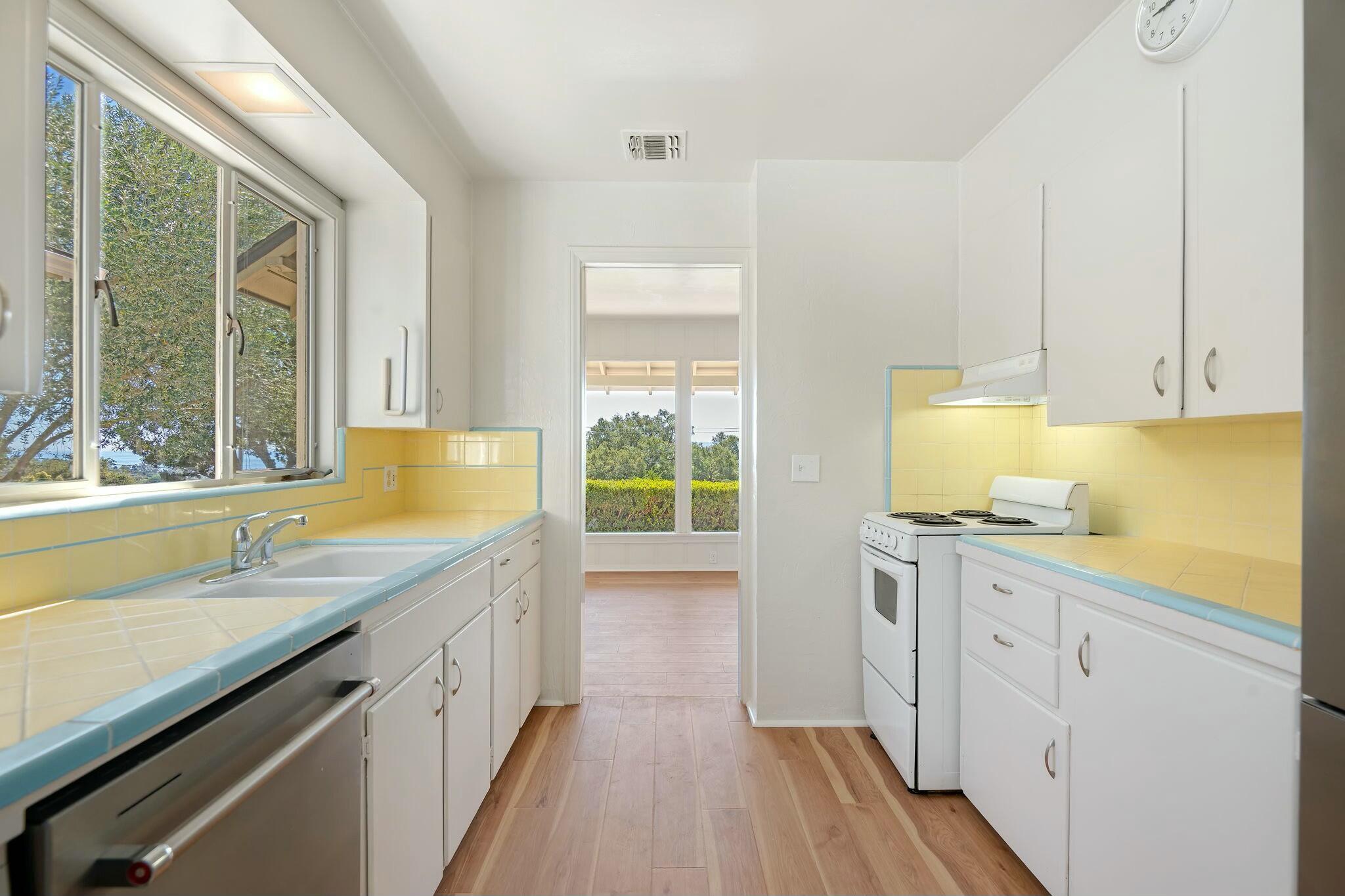 2986 Kenmore Place Santa Barbara, CA 93105 - Photo 10 of 49 a kitchen with a sink stove and cabinets