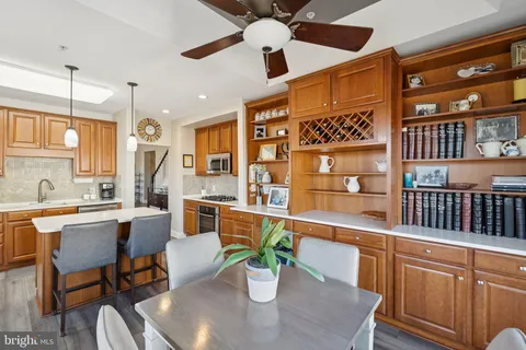 a dining table with chairs and chandelier