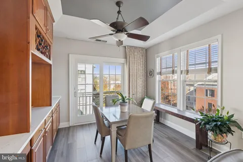 a view of a dining room with furniture window and wooden floor