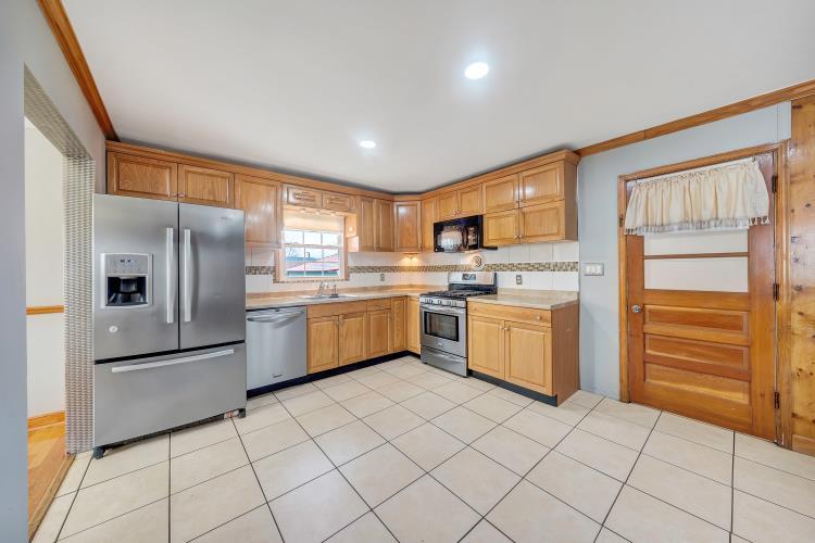 5001 Hildebrand Road Northwest Roanoke, VA 24012 - Photo 16 of 36 a kitchen with a refrigerator sink and cabinets