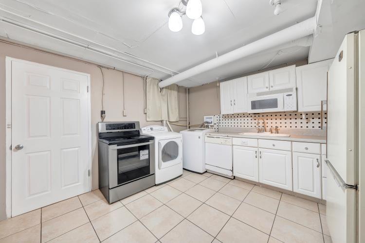 5001 Hildebrand Road Northwest Roanoke, VA 24012 - Photo 25 of 36 a kitchen with a stove sink and cabinets