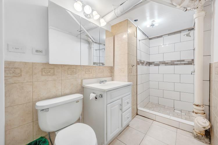 5001 Hildebrand Road Northwest Roanoke, VA 24012 - Photo 35 of 36 a bathroom with a sink toilet and shower