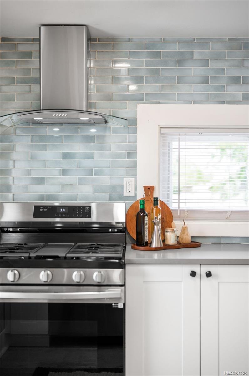 3855 Cook Street Denver, CO 80205 - Photo 11 of 22 a kitchen with a stove and a cabinets