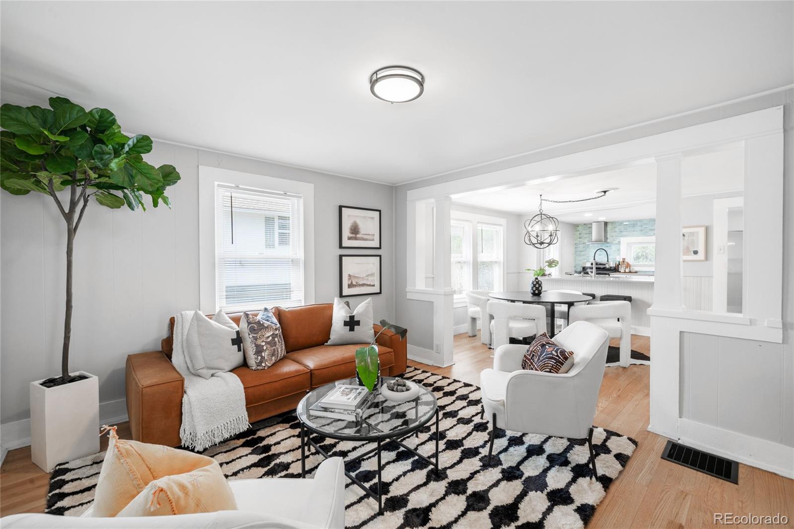 3855 Cook Street Denver, CO 80205 - Photo 4 of 22 a living room with furniture