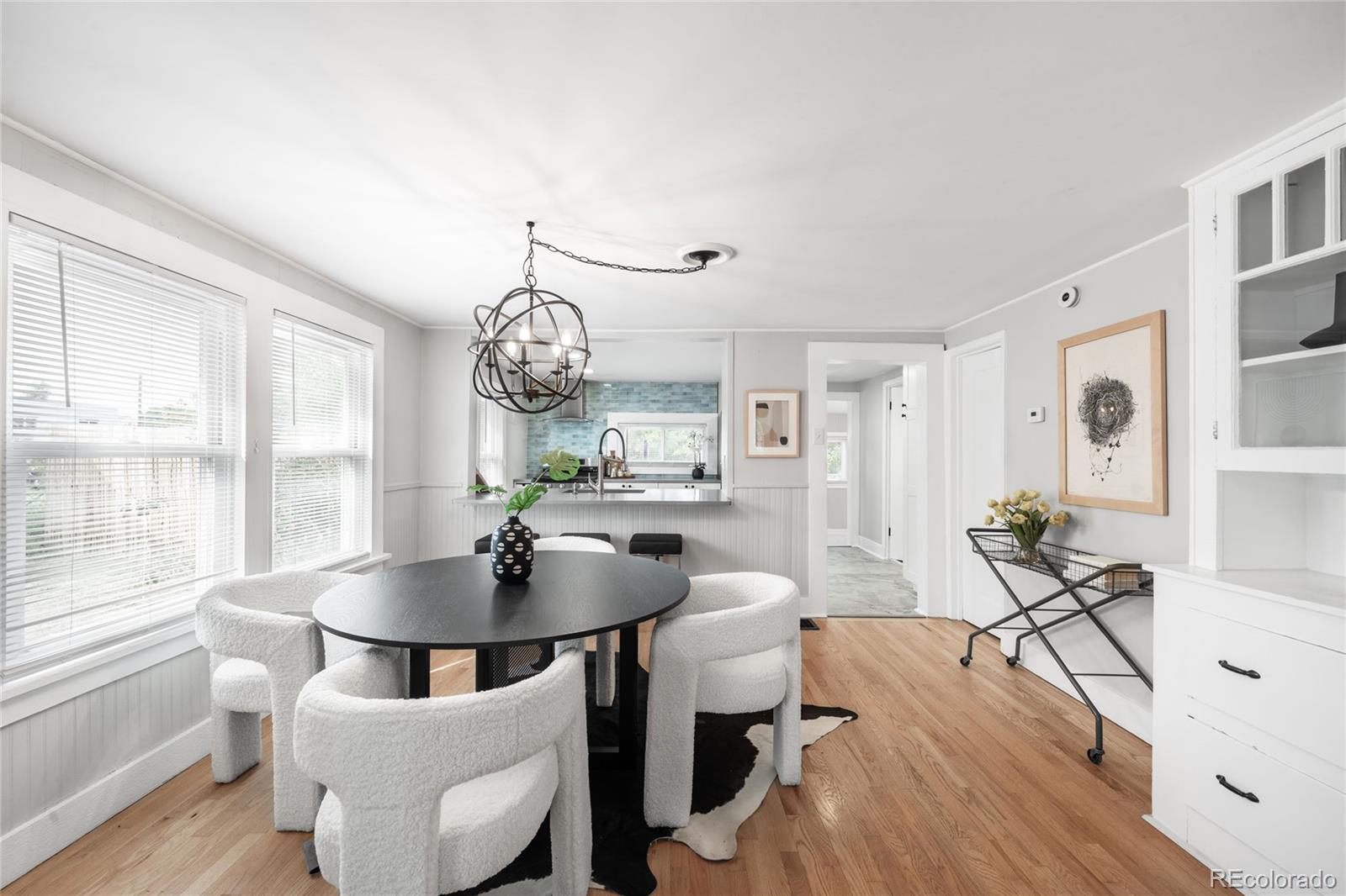 3855 Cook Street Denver, CO 80205 - Photo 5 of 22 a view of a dining room with furniture window and wooden floor