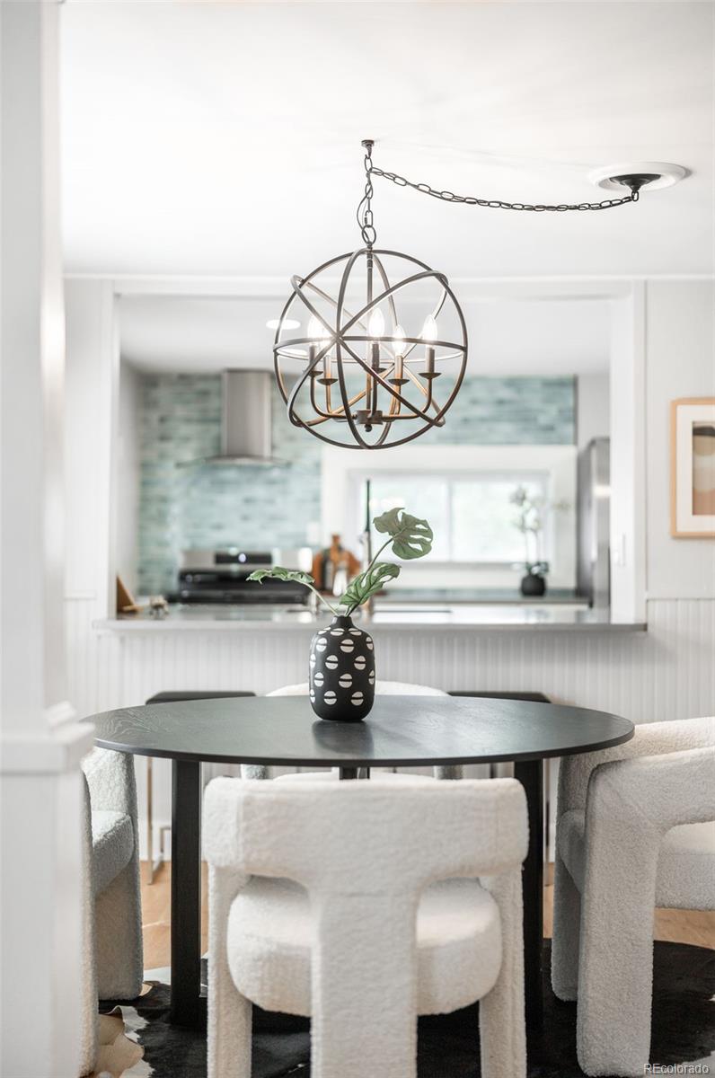 3855 Cook Street Denver, CO 80205 - Photo 7 of 22 a kitchen with a table and chairs in it