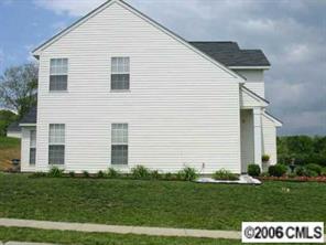 5205 Elizabeth Road Charlotte, NC 28269 - Photo 5 of 8 a front view of a house with a yard