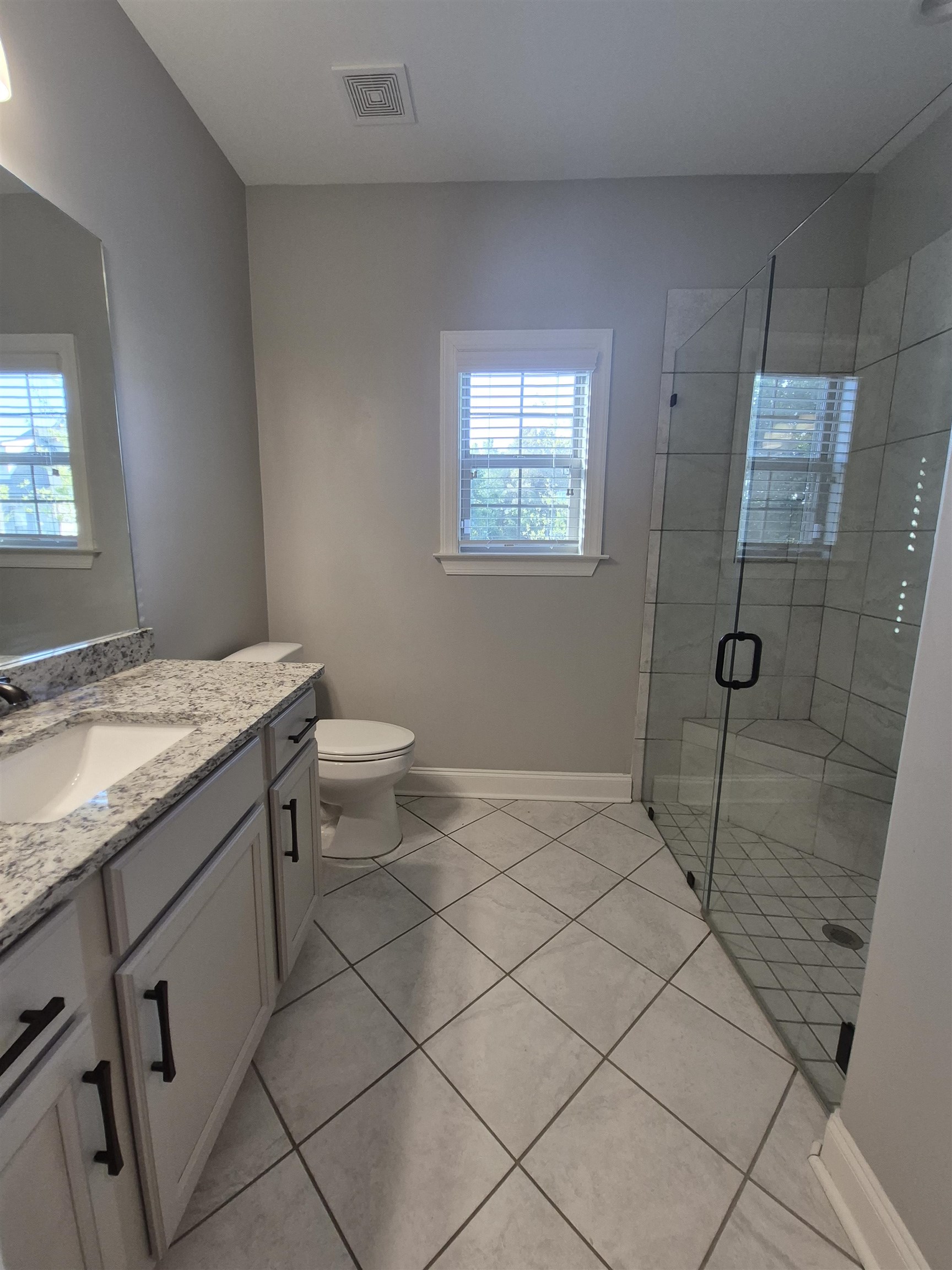 5120 Moudry Lane Lakeland, TN 38002 - Photo 14 of 34 a bathroom with a granite countertop sink and a toilet