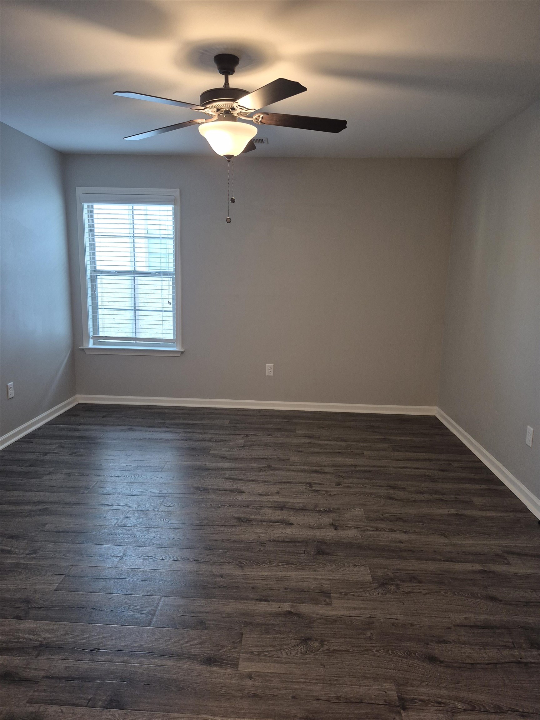 5120 Moudry Lane Lakeland, TN 38002 - Photo 21 of 34 wooden floor in an empty room with a window