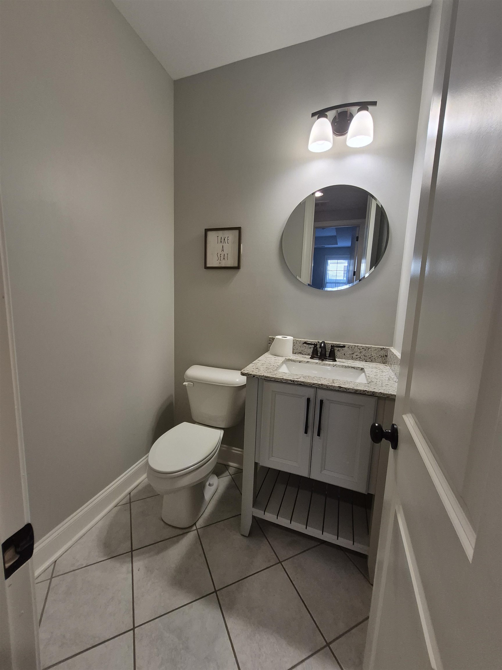 5120 Moudry Lane Lakeland, TN 38002 - Photo 24 of 34 1/2 Bathroom featuring vanity and tile patterned floors