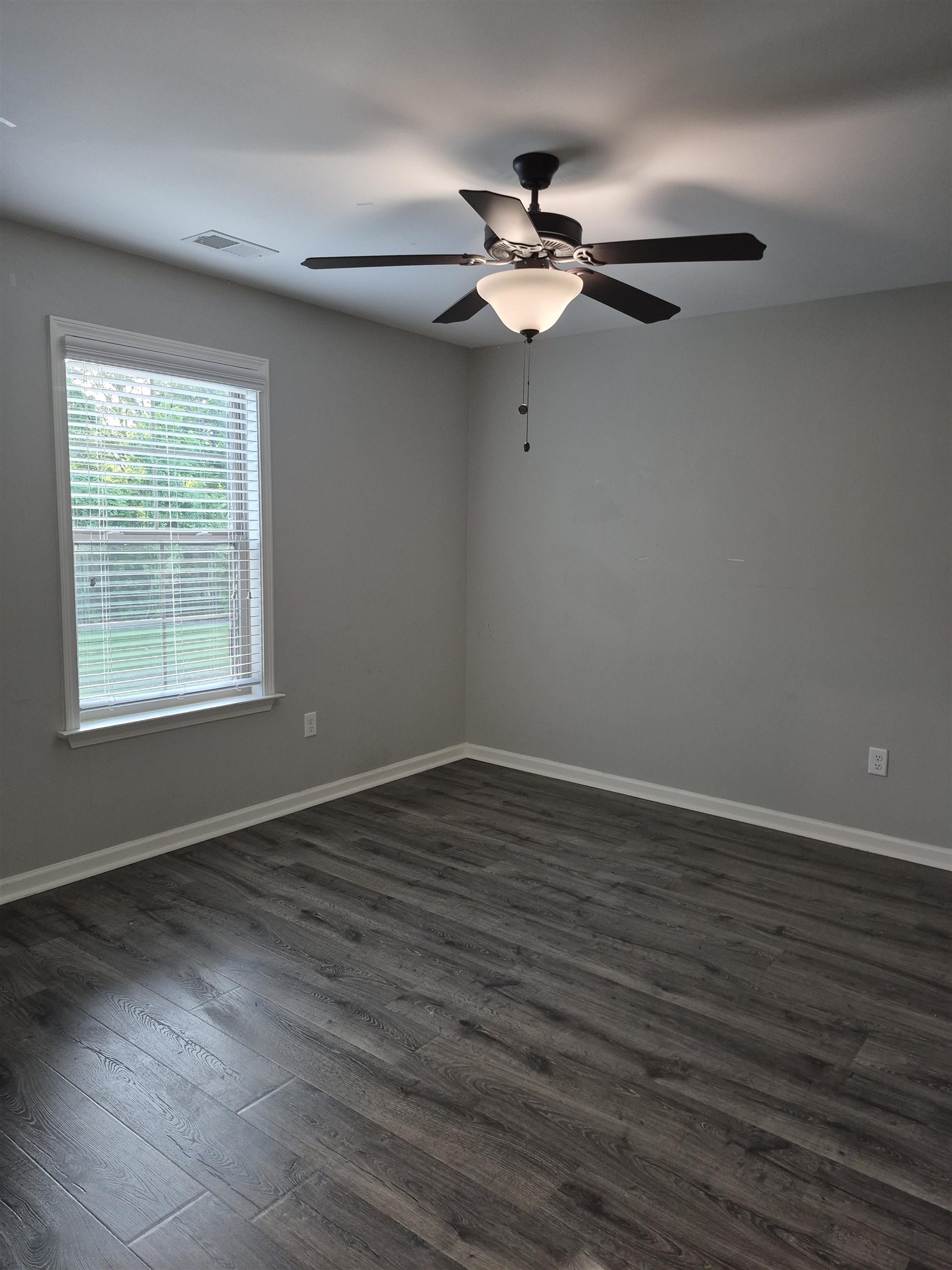 5120 Moudry Lane Lakeland, TN 38002 - Photo 30 of 34 a view of an empty room with wooden floor and a window