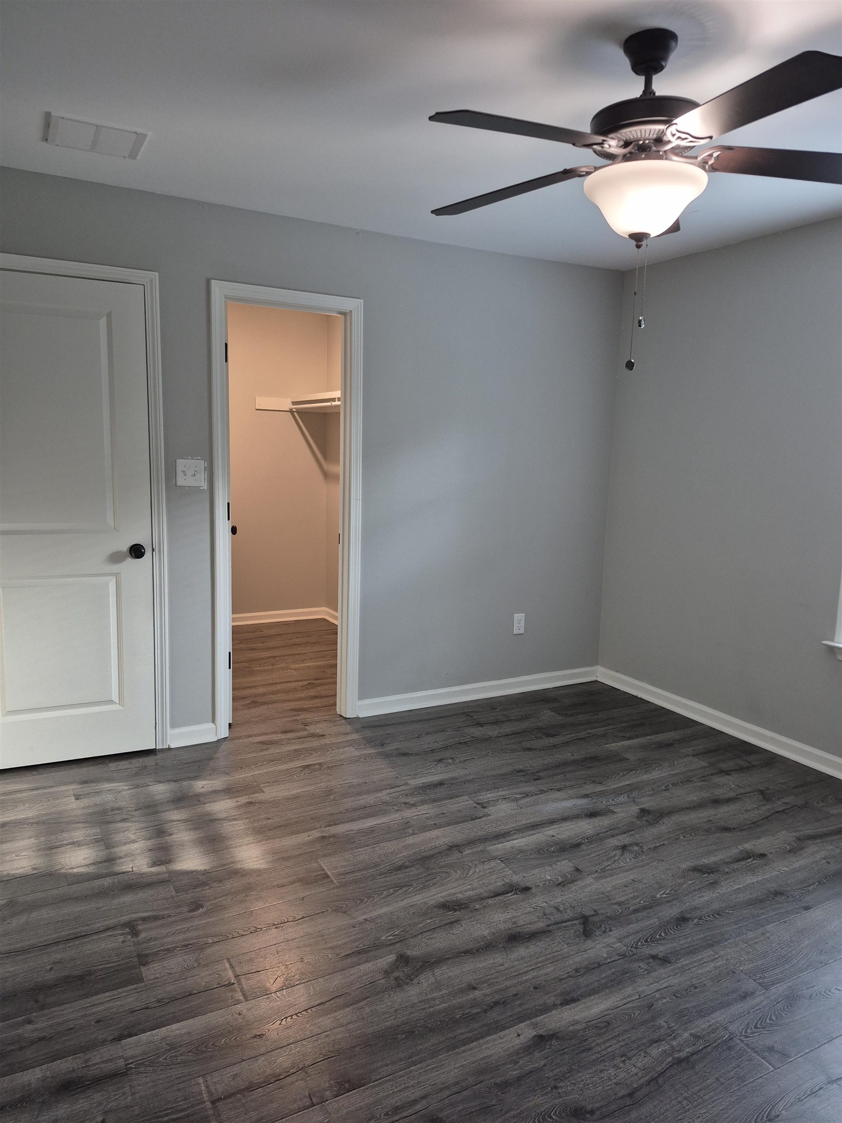 5120 Moudry Lane Lakeland, TN 38002 - Photo 31 of 34 Unfurnished room featuring ceiling fan and dark wood-type flooring