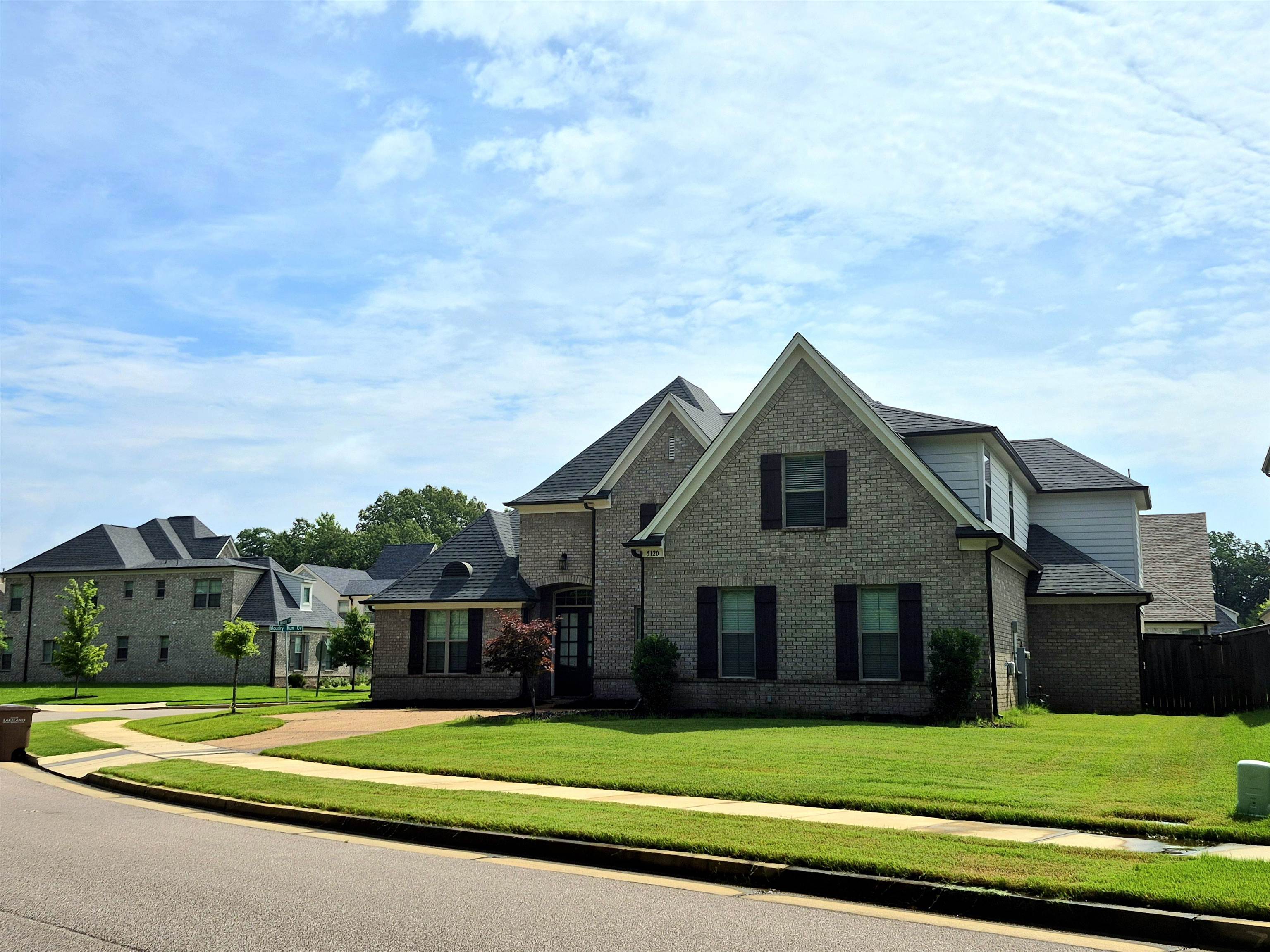 5120 Moudry Lane Lakeland, TN 38002 - Photo 33 of 34 a front view of a house with a yard