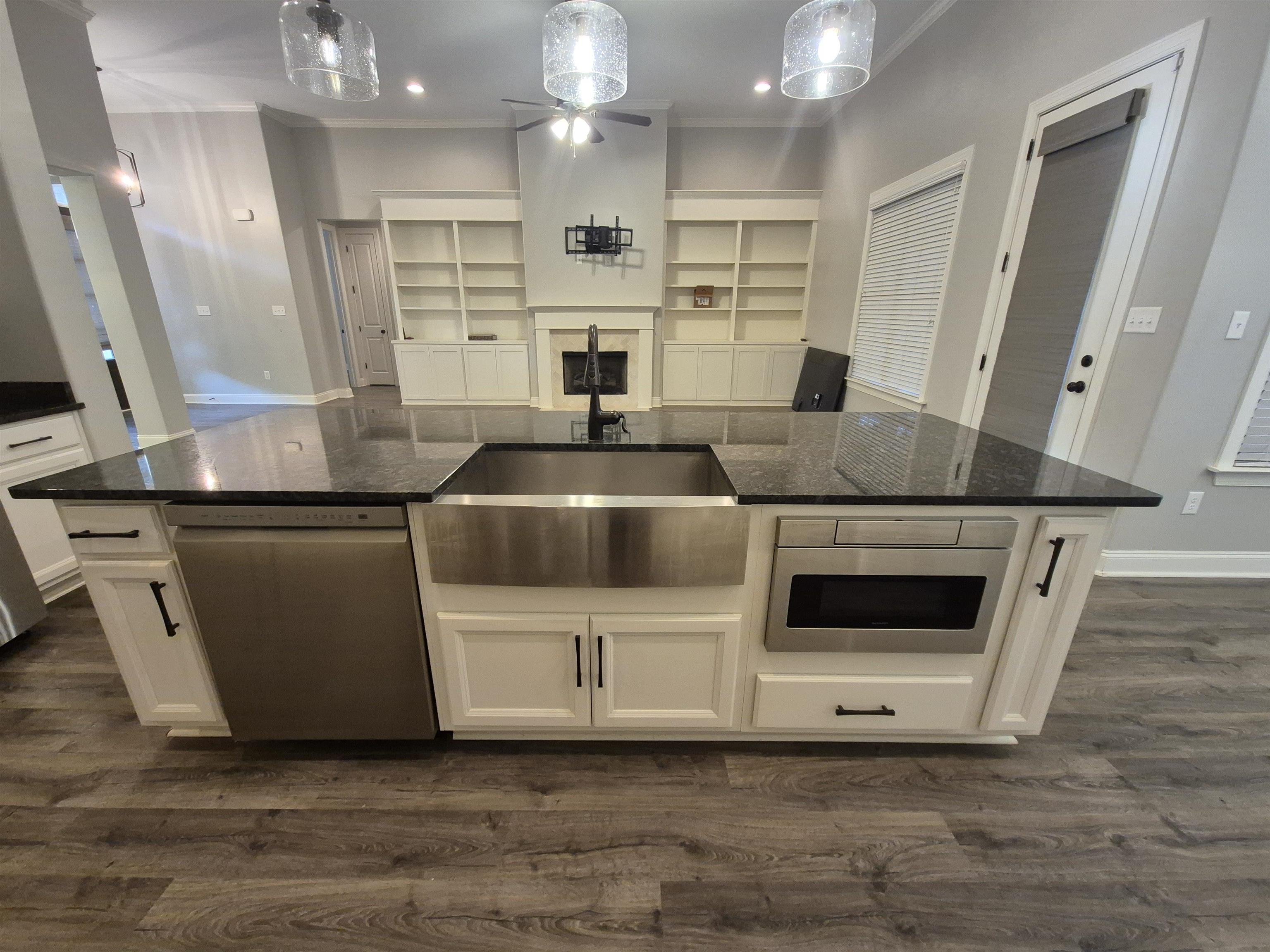 5120 Moudry Lane Lakeland, TN 38002 - Photo 34 of 34 a kitchen with stainless steel appliances granite countertop a sink and a refrigerator
