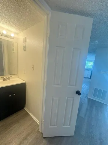 a bathroom with a sink and mirror