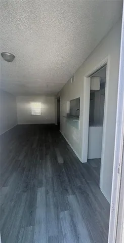 a view of a room with wooden floors and led lights