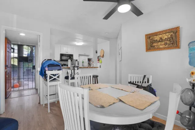 a view of a dining room with furniture and wooden floor