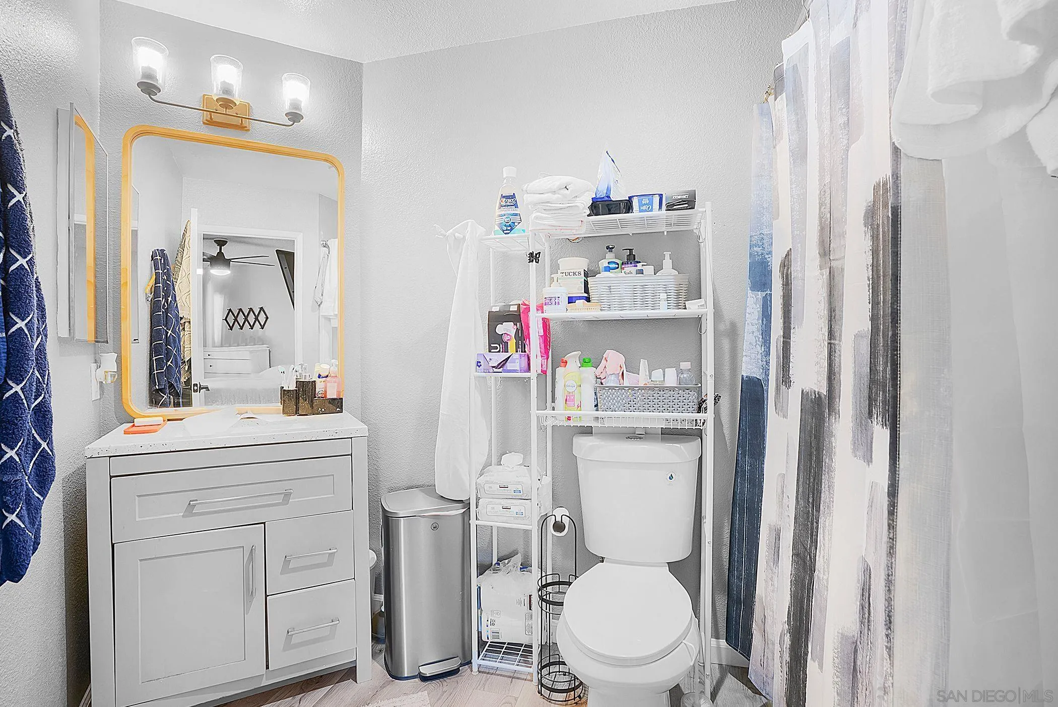 3065 Charwood Court Spring Valley, CA 91978 - Photo 11 of 23 a bathroom with a toilet sink and mirror