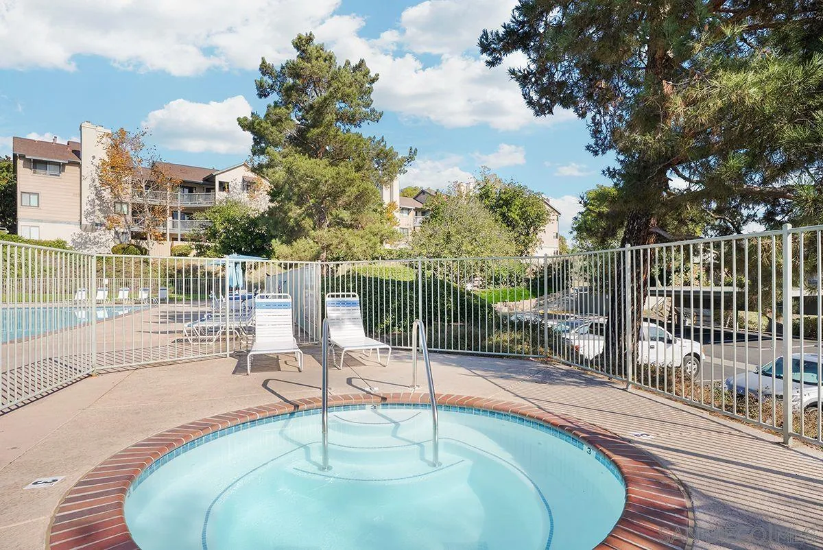 3065 Charwood Court Spring Valley, CA 91978 - Photo 21 of 23 a view of a patio with a table chairs and a floor to ceiling window
