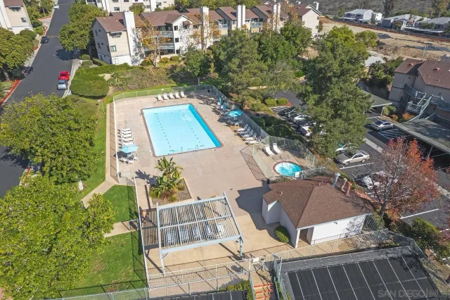 an aerial view of a house with outdoor space and sitting area