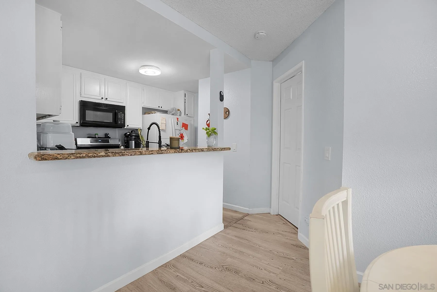 3065 Charwood Court Spring Valley, CA 91978 - Photo 3 of 23 a view of kitchen and wooden floor