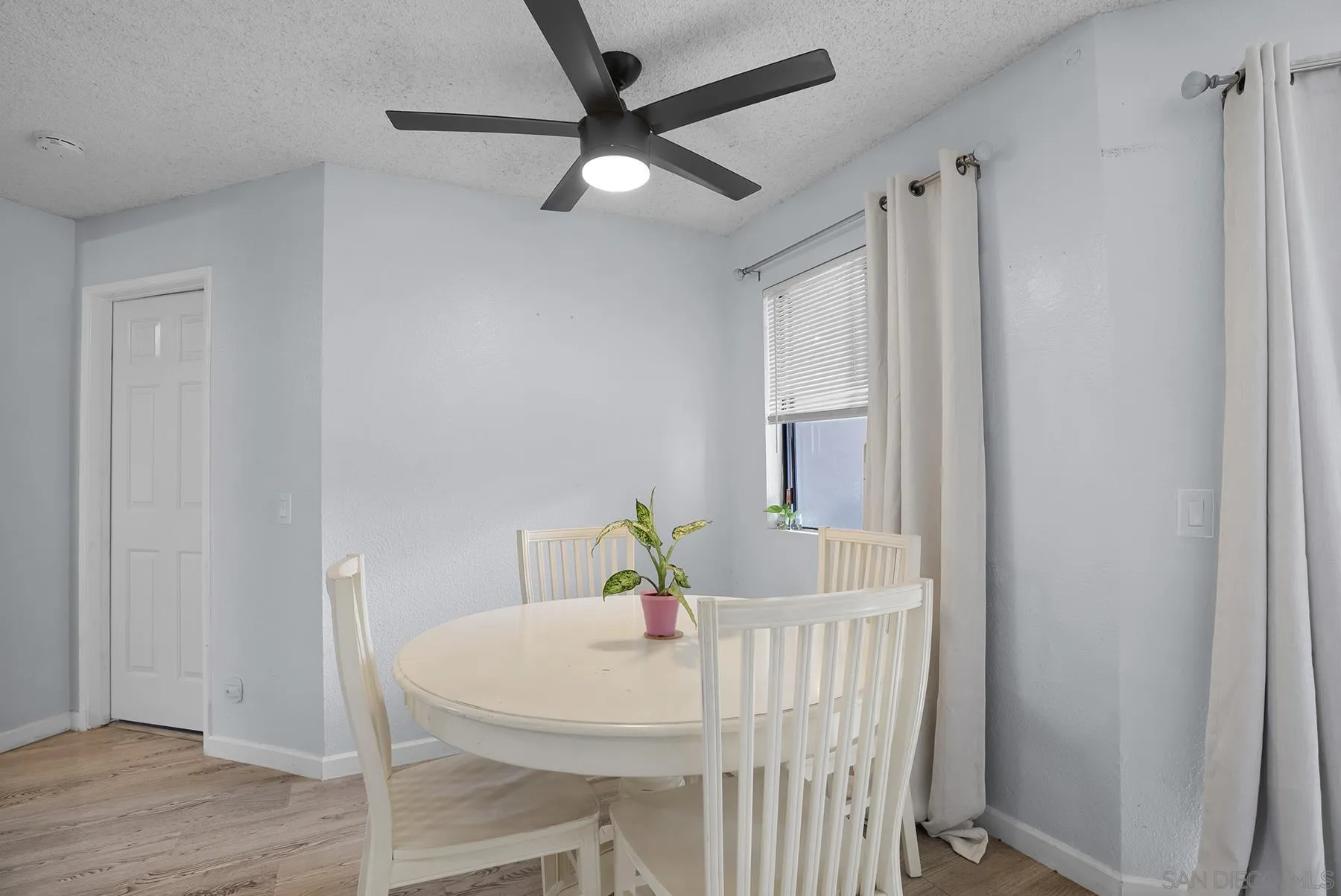 3065 Charwood Court Spring Valley, CA 91978 - Photo 4 of 23 a view of a dining room with a table and chairs