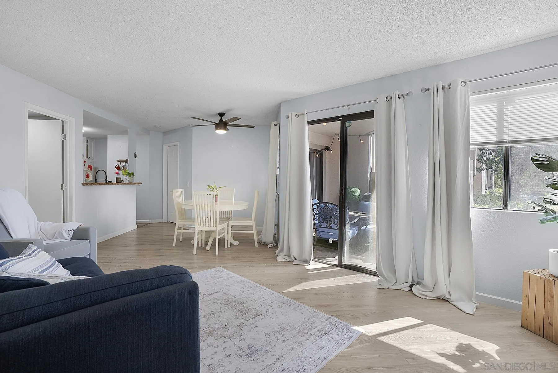 3065 Charwood Court Spring Valley, CA 91978 - Photo 5 of 23 a living room with furniture and a dining table with wooden floor