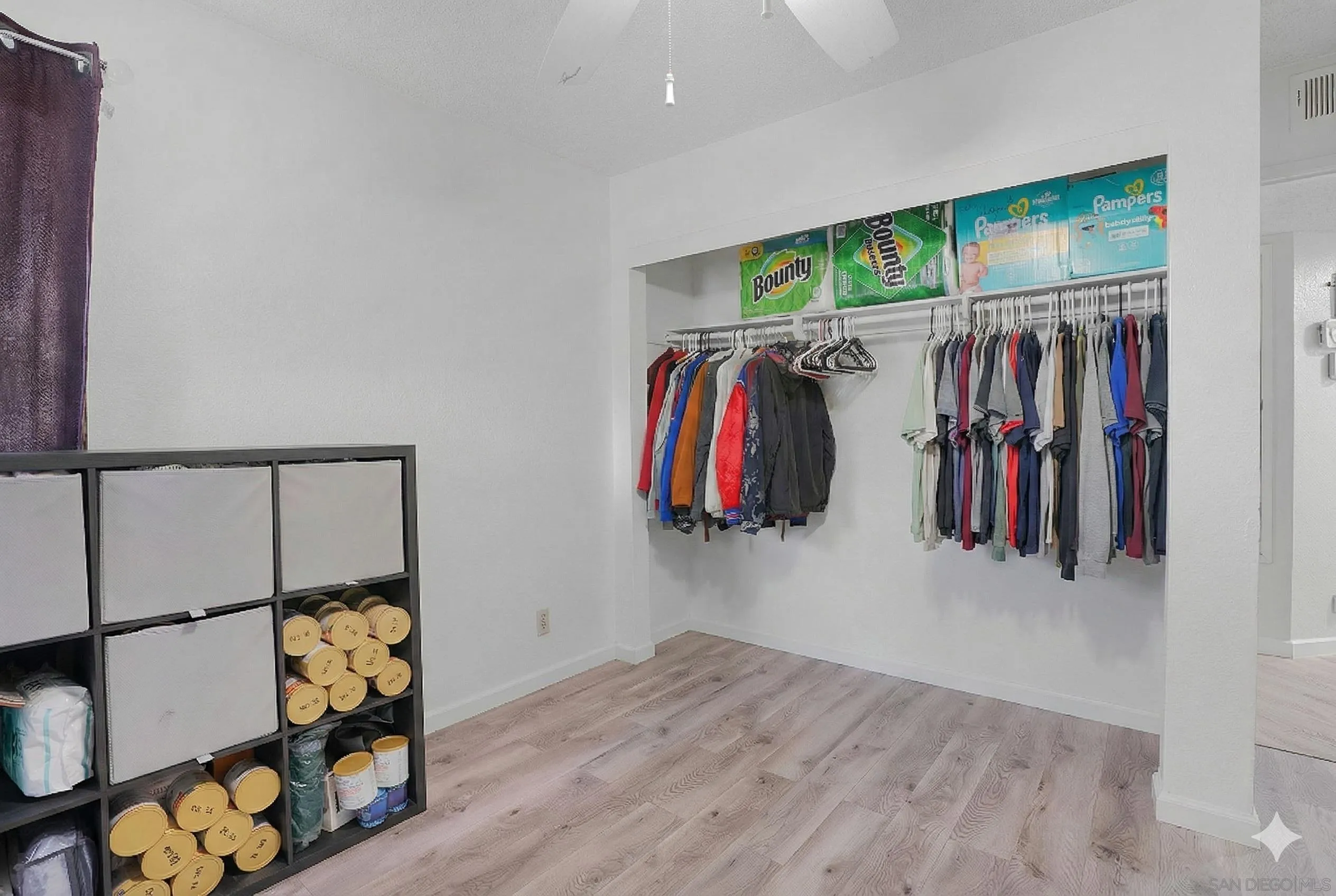3065 Charwood Court Spring Valley, CA 91978 - Photo 7 of 23 a view of walk in closet with clothes and shoes