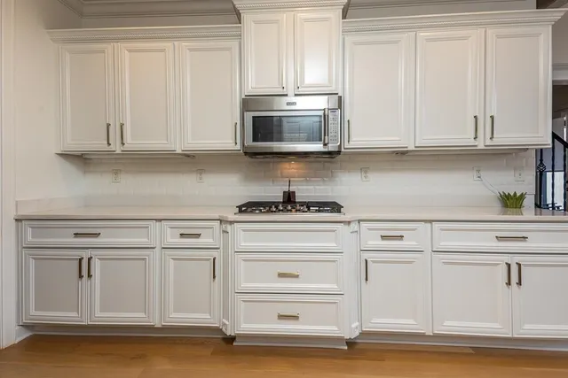 a bed room with a bed and a chair