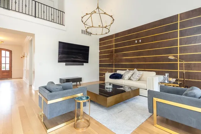 a front view of a house with a yard outdoor seating and garage