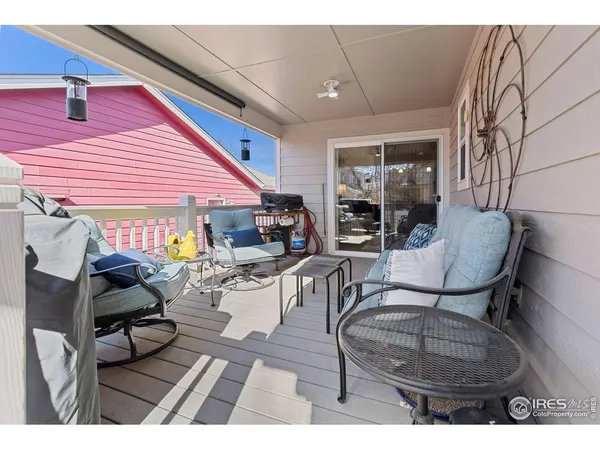 a living room with furniture a fireplace and a window