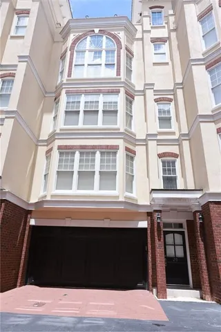 a black and white building with a large window