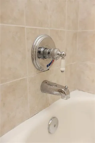 a bathroom with a vanity and a shower