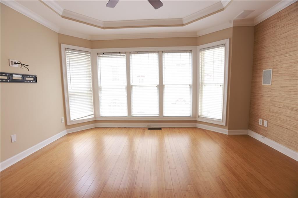 3541 Roswell Road Northeast, Unit 20 Atlanta, GA 30305 - Photo 30 of 72 a view of room with window and wooden floor