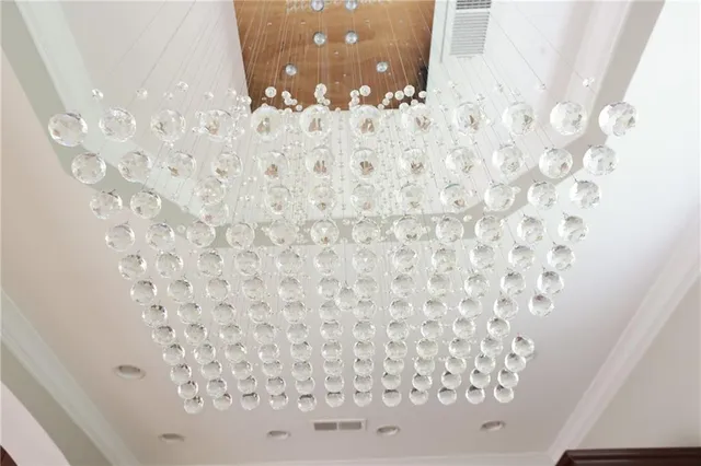 a view of a kitchen with wooden floor and a window