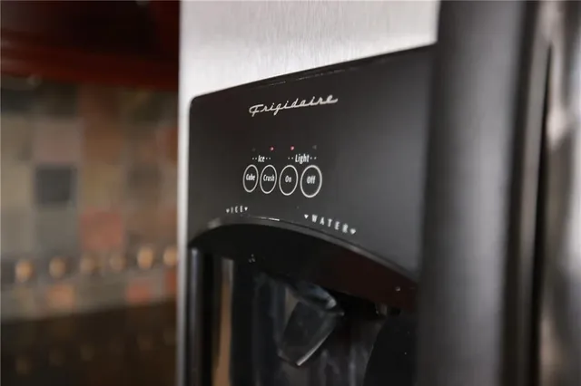 a view of staircase with lots of frames on wall