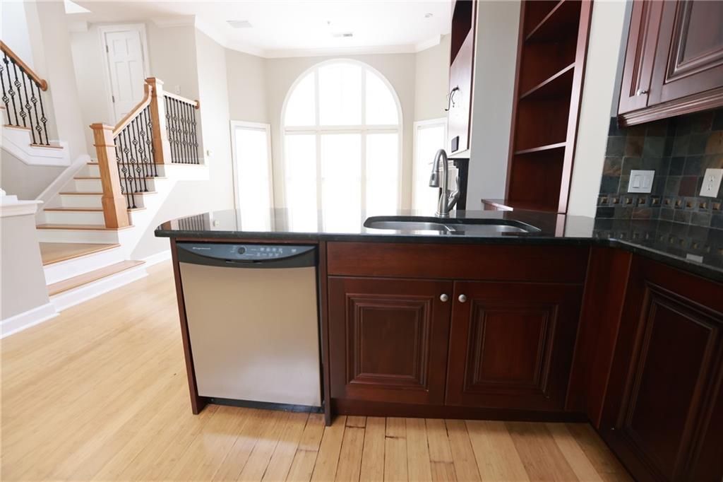3541 Roswell Road Northeast, Unit 20 Atlanta, GA 30305 - Photo 48 of 72 a view of a kitchen with wooden floor and a window