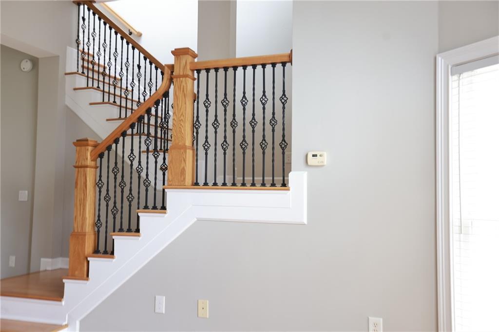 3541 Roswell Road Northeast, Unit 20 Atlanta, GA 30305 - Photo 55 of 72 a view of staircase with lots of frames on wall