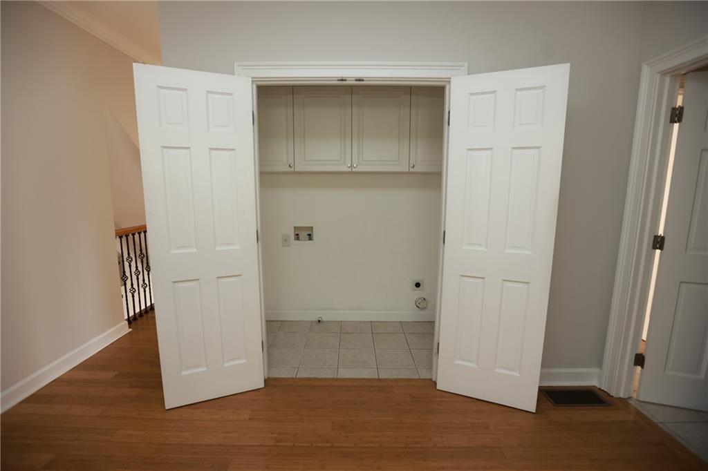 3541 Roswell Road Northeast, Unit 20 Atlanta, GA 30305 - Photo 9 of 72 an empty room with wooden floor and closet