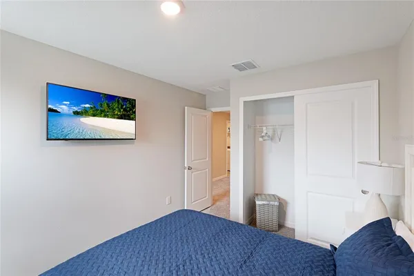 a view of a room with wooden floor and cabinet