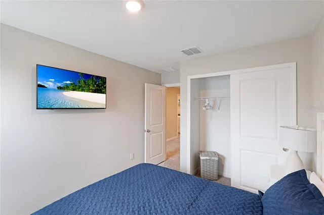 a view of a room with wooden floor and cabinet